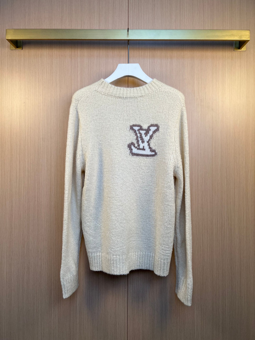 Louis Vuitton knit sweater with ribbed crew neck and dark LV monogram logo, full front view