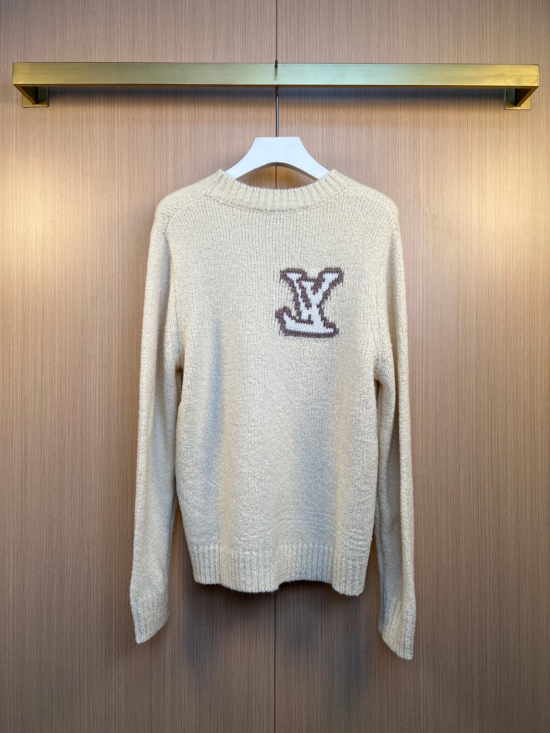 Louis Vuitton knit sweater with ribbed crew neck and dark LV monogram logo, full front view