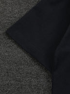 Folded black short-sleeve T-shirt with clean side seam