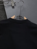 Back of black Fendi short-sleeve T-shirt on hanger, crew neck detail