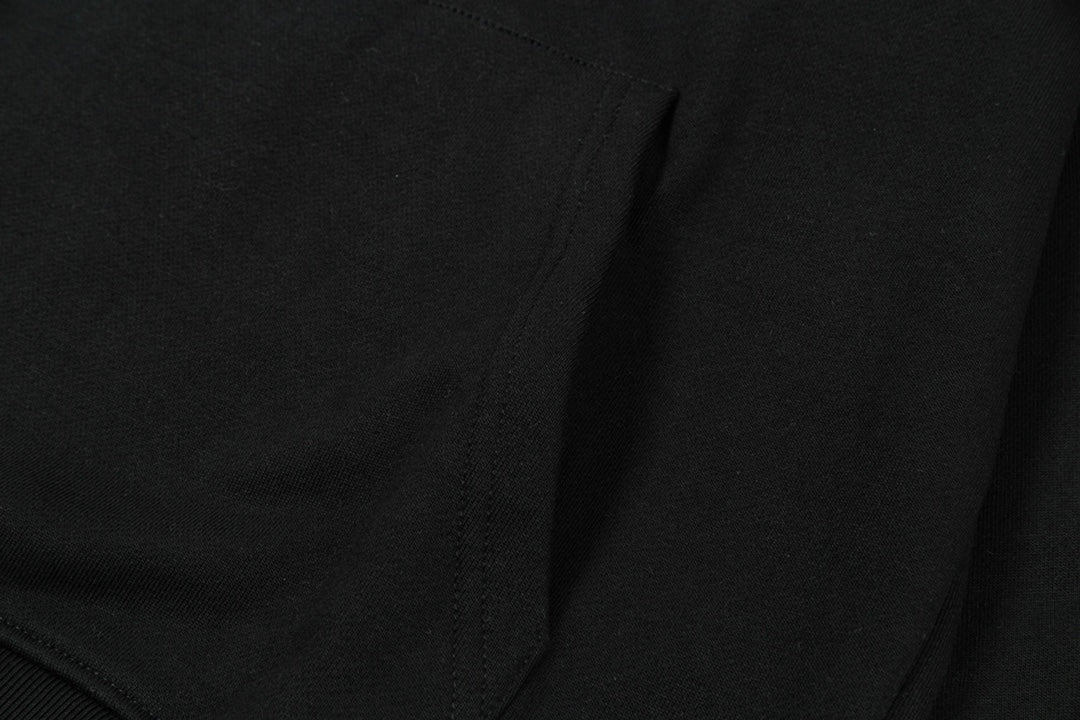 Black hoodie fabric and seam detail