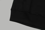 Black hoodie ribbed hem and sleeve cuff detail