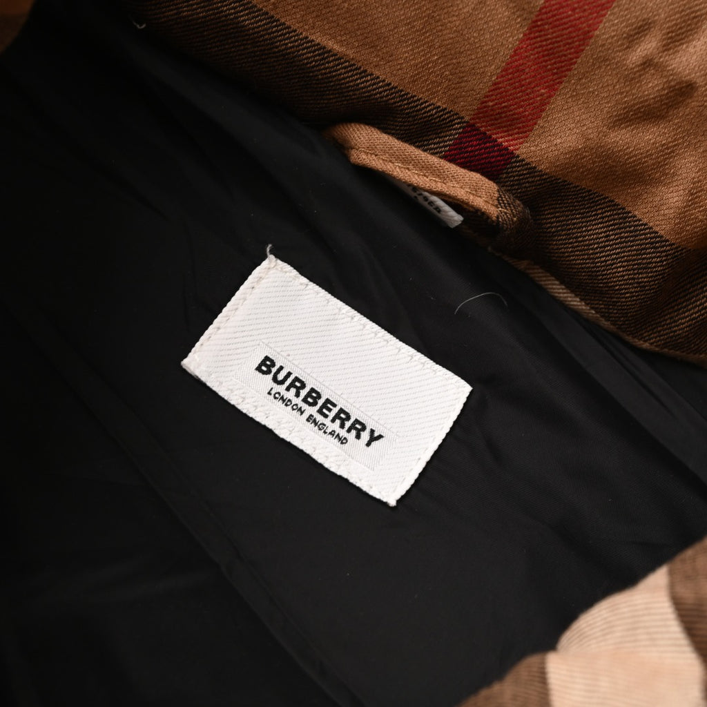 Fabric brand label on black lining inside hooded jacket