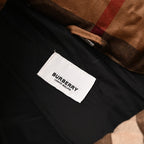 Fabric brand label on black lining inside hooded jacket