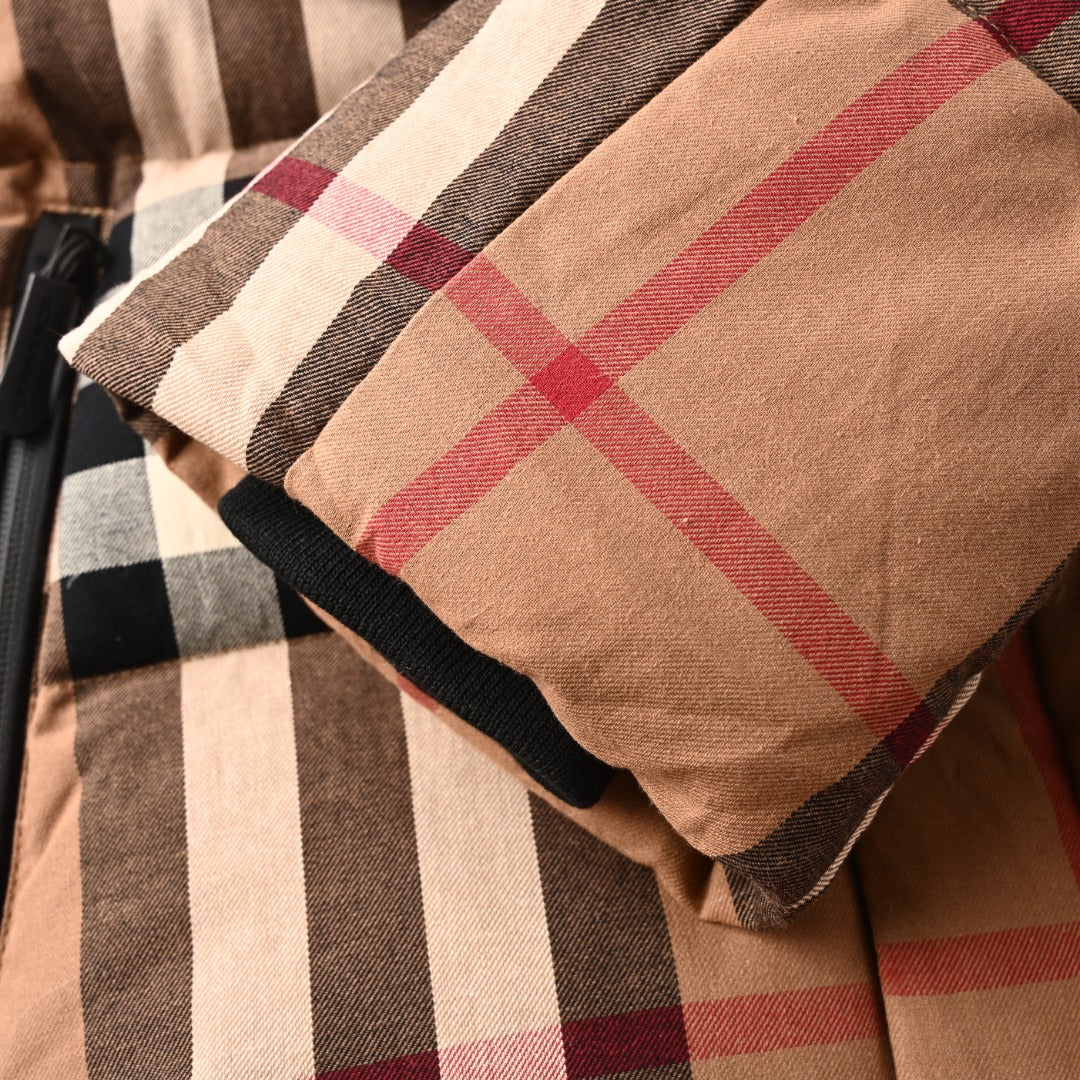 Plaid sleeve cuff with black elastic trim on long quilted jacket