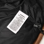 Black lining with Burberry care label and drawcord toggle