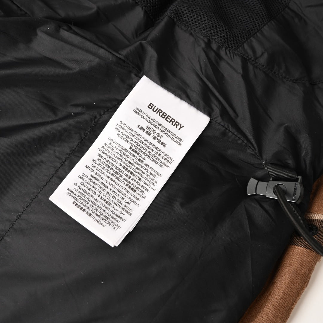 Black lining with Burberry care label and drawcord toggle