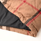 Quilted jacket hem with plaid outer and black inner lining
