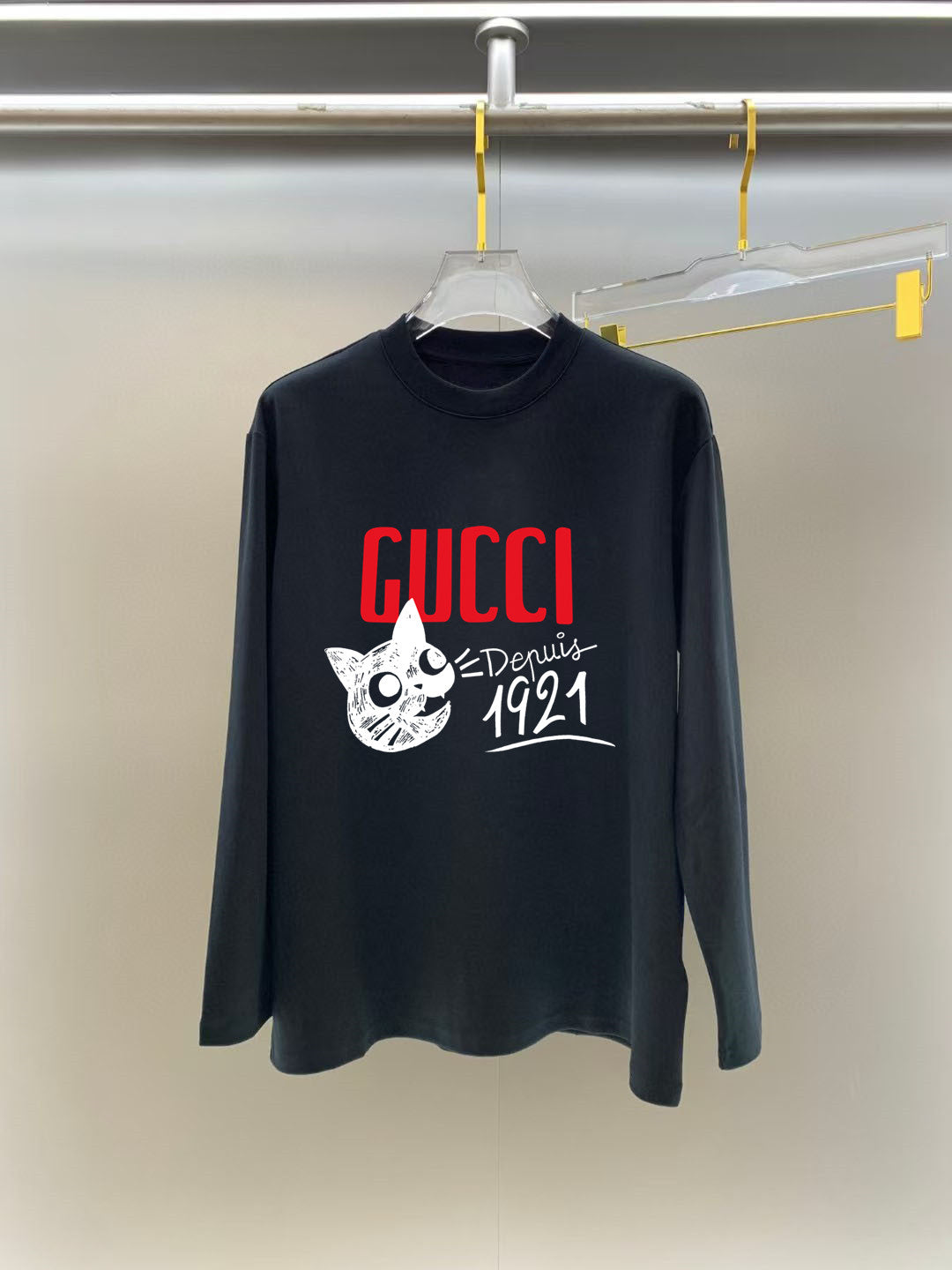 Dark long-sleeve crewneck T-shirt with red GUCCI logo and white cat graphic