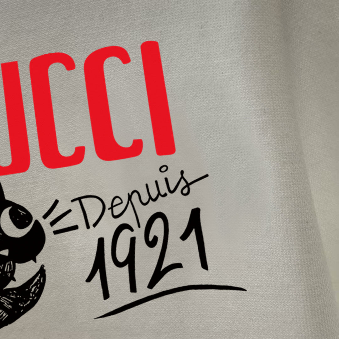 White long-sleeve T-shirt close-up of GUCCI logo and 1921 cat graphic