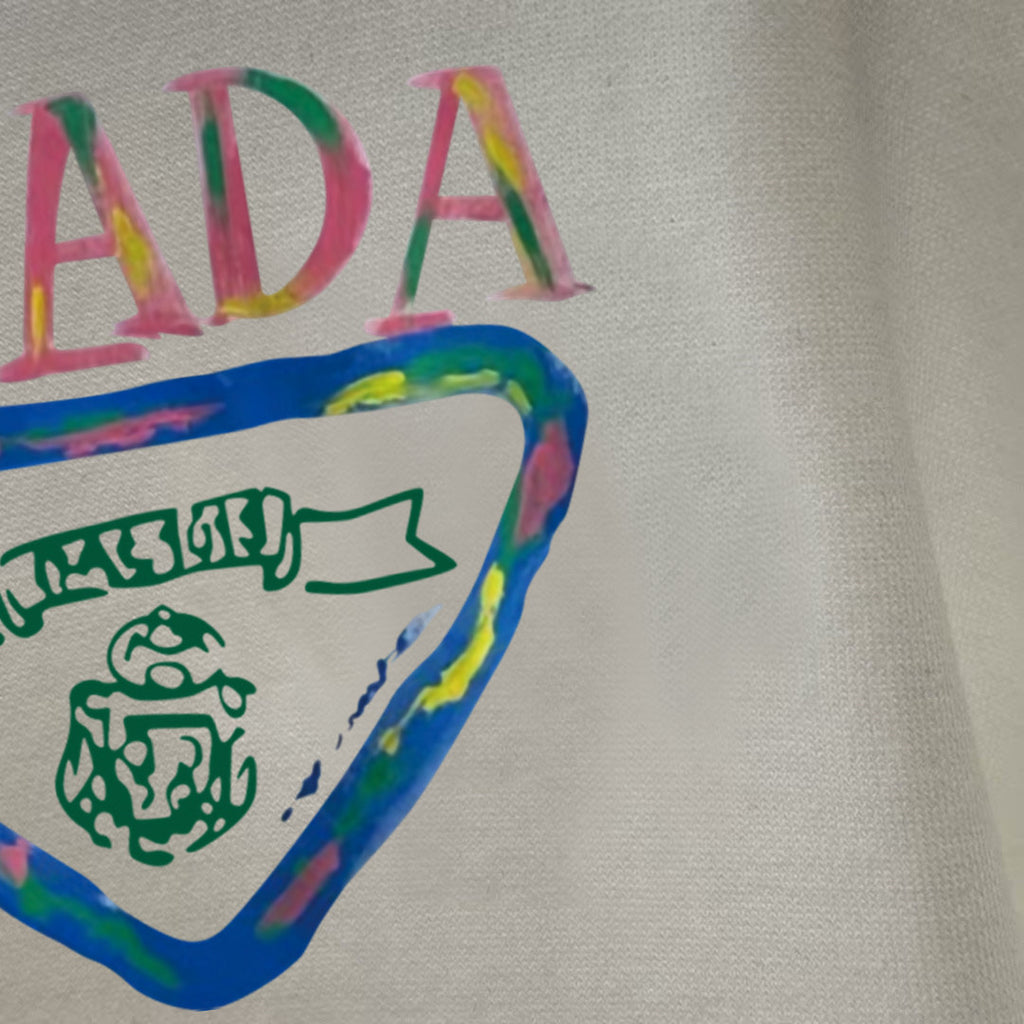 Prada graphic long-sleeve top, white, close-up of PRADA letters and triangle