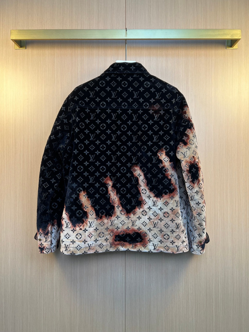 Louis Vuitton long jacket with navy monogram pattern and flame-pattern lower panel