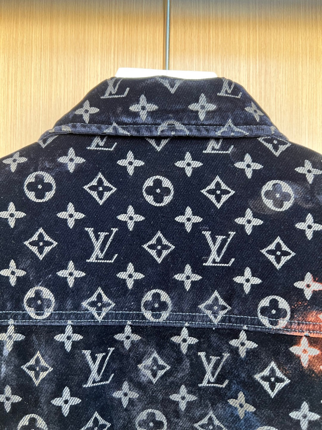 Louis Vuitton monogram jacket fabric with repeating logos and geometric icons