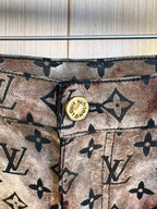 Louis Vuitton pants waistband close-up with gold button and belt loops