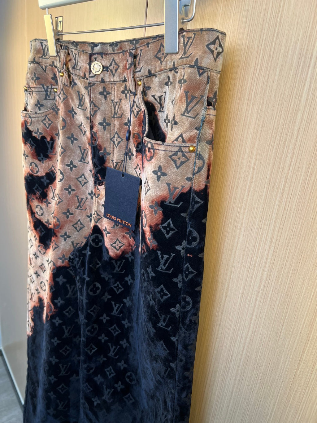 Louis Vuitton pants with mixed patterns: tan monogram upper and dark lower