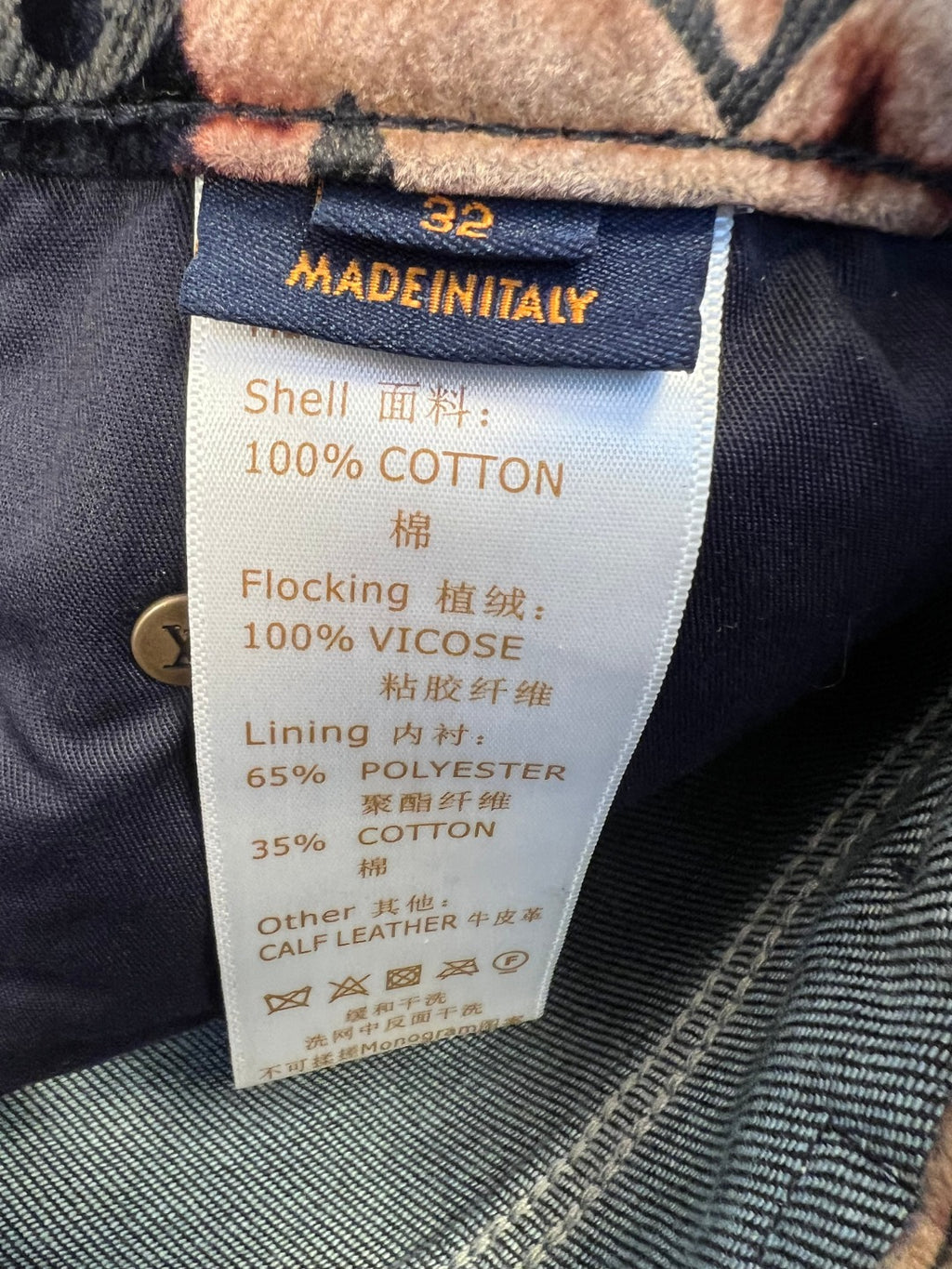 Clothing care/materials tag: 100% cotton shell, viscose detail, polyester lining