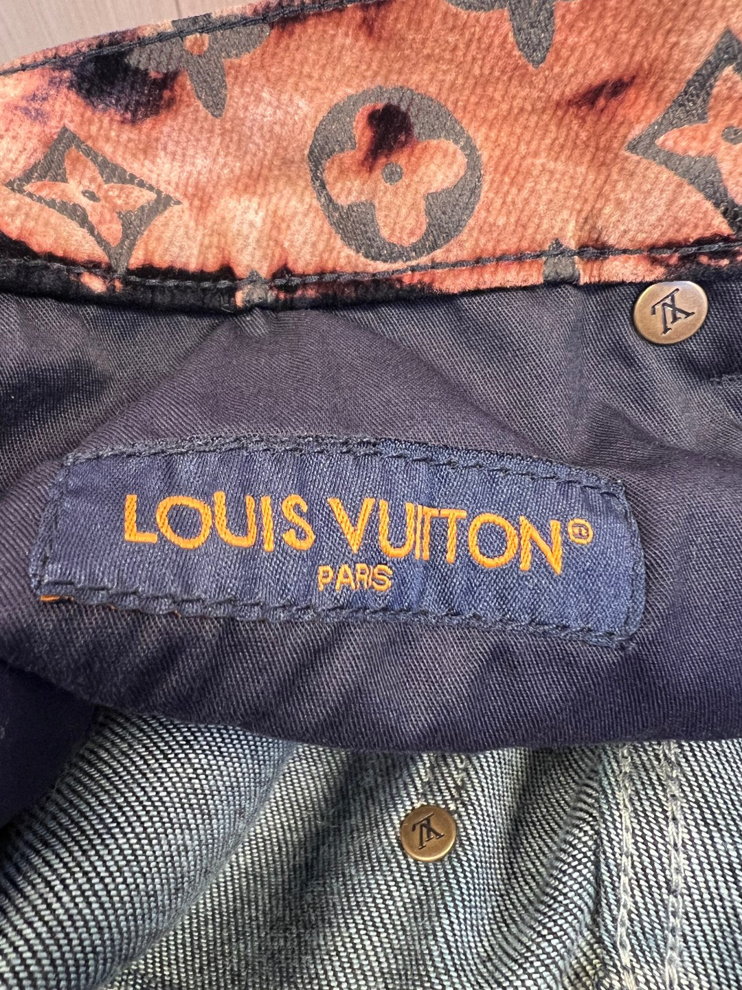 Louis Vuitton Paris fabric label inside dark pants