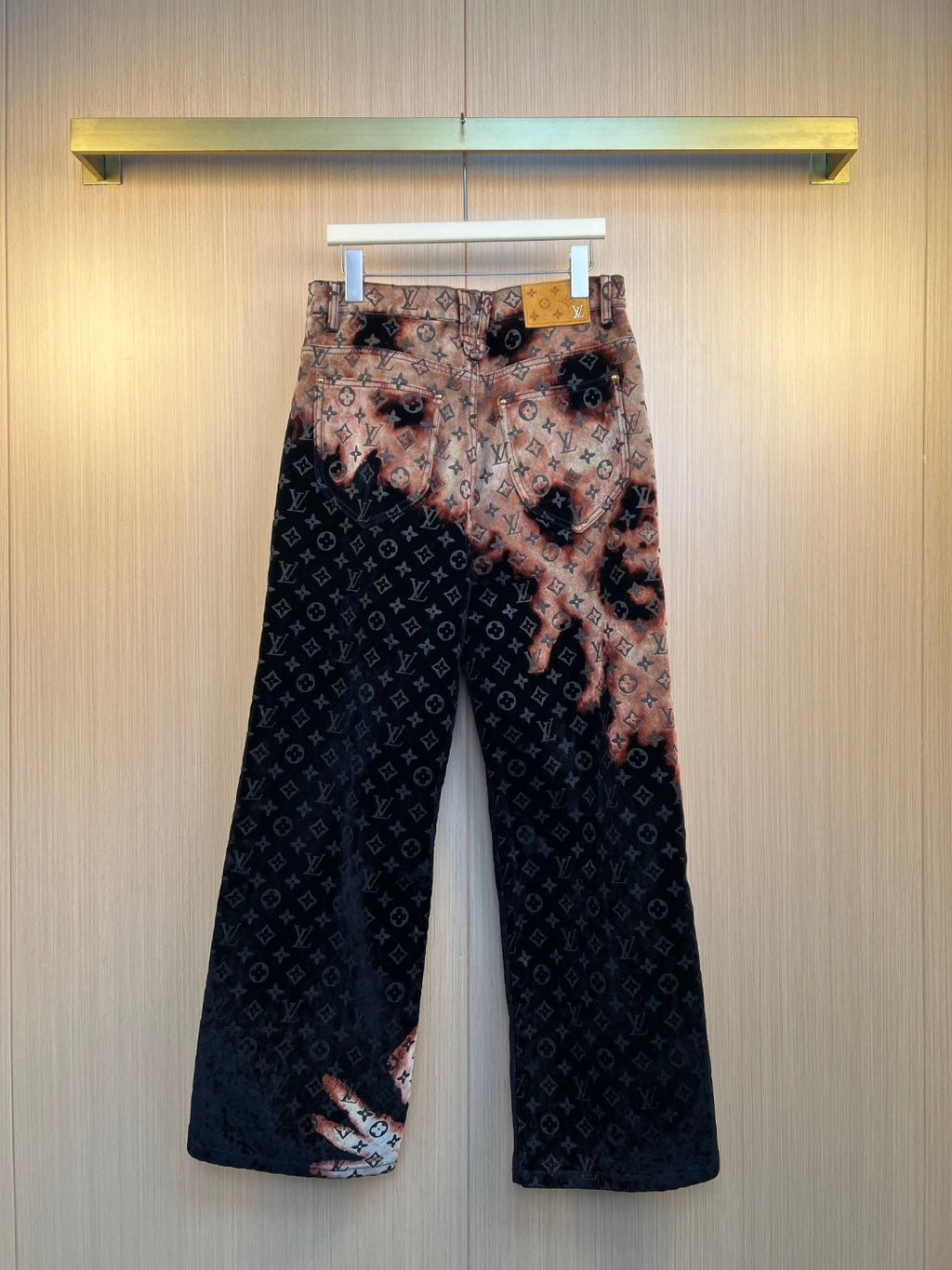 Louis Vuitton wide-leg pants, dark monogram with tan patterned overlay