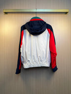 Back view hooded jacket with white body and red, navy, and green colorblock stripes