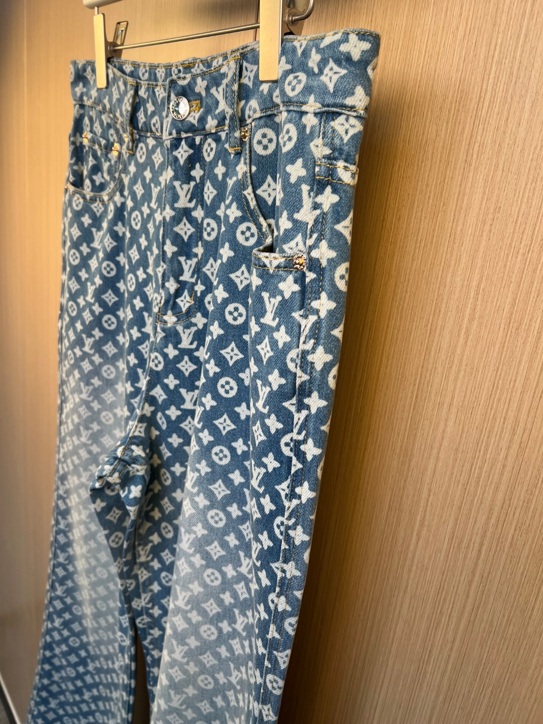 Blue monogram denim pants with wide legs and front pocket detail