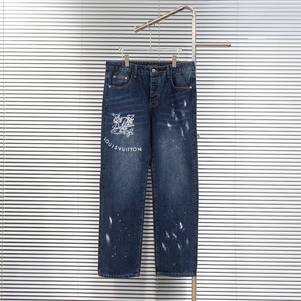 Dark blue denim jeans with Louis Vuitton logo patch and distressed graphic print on leg