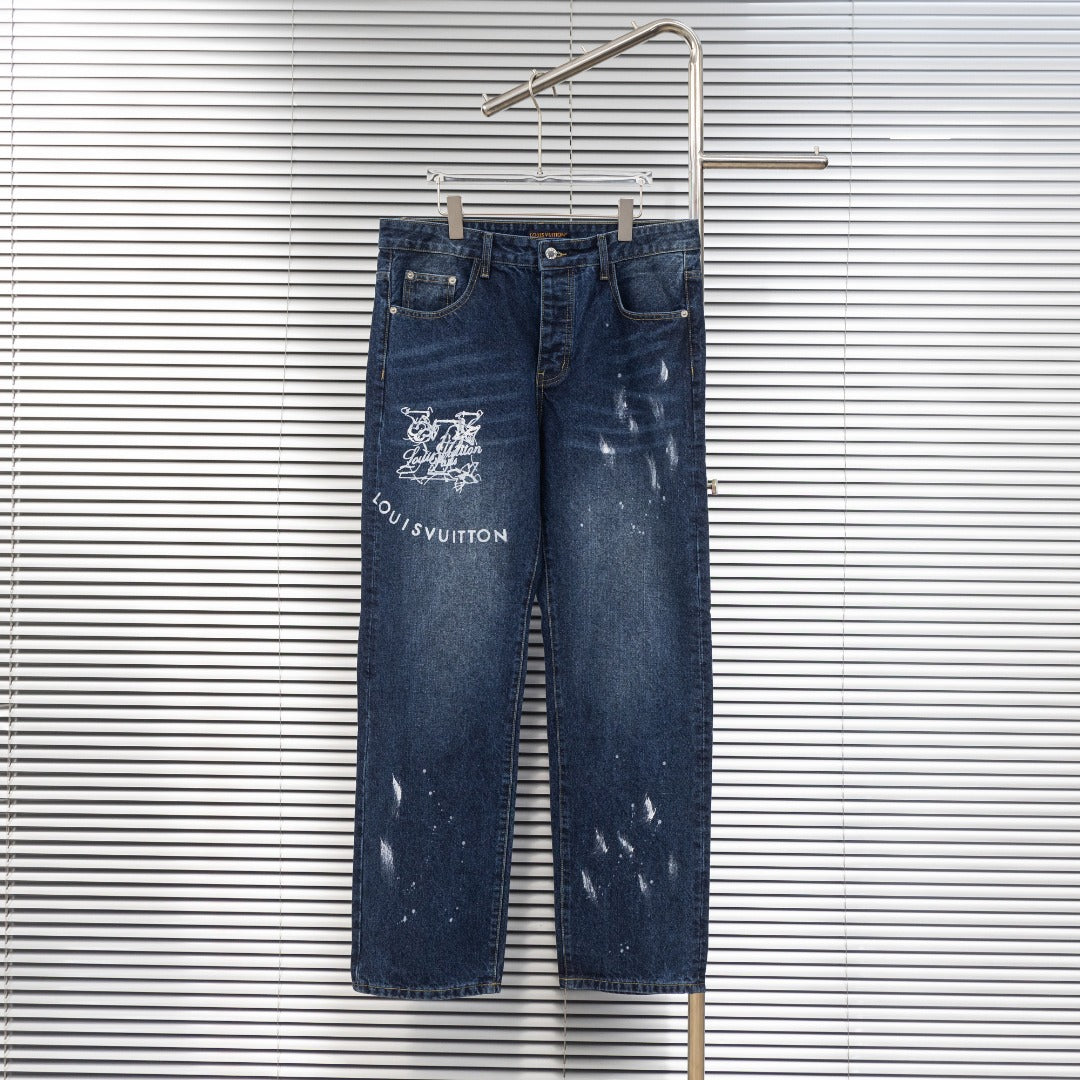 Dark blue denim jeans with Louis Vuitton logo patch and distressed graphic print on leg