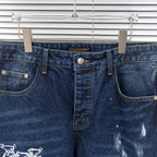 Front view of dark blue denim jeans with button waistband and dual front pockets