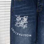 Back leg of dark blue denim jeans with white Louis Vuitton graphic and logo text