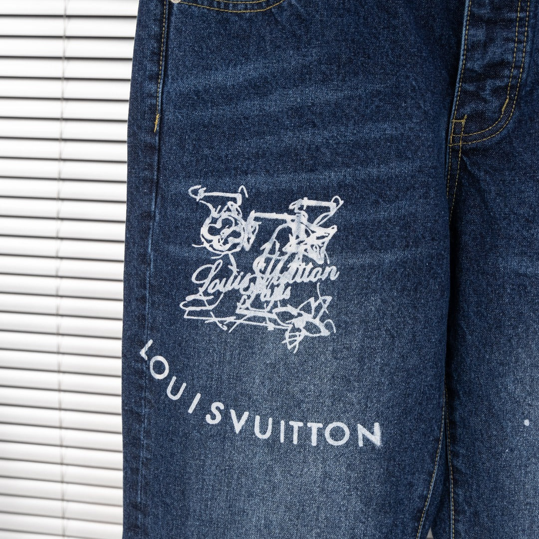Back leg of dark blue denim jeans with white Louis Vuitton graphic and logo text