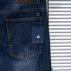 Dark blue denim jeans pocket with Louis Vuitton size tag and stitched edges