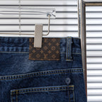 Denim pants with Louis Vuitton monogram waistband patch and front button