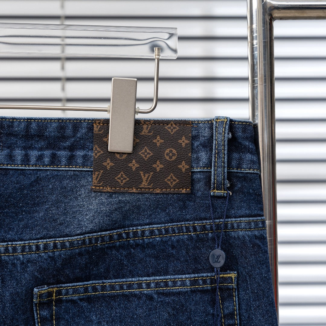 Denim pants with Louis Vuitton monogram waistband patch and front button