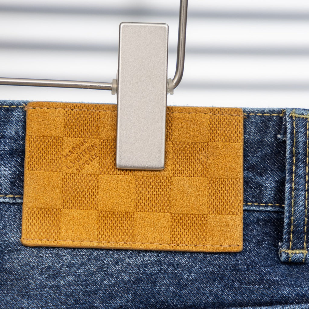 Louis Vuitton pants, blue denim with yellow fabric patch detail