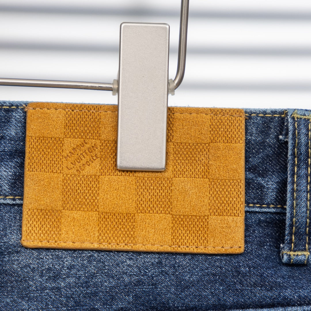 Louis Vuitton pants, blue denim with yellow fabric patch detail