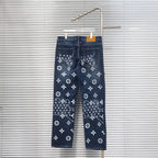 Louis Vuitton denim pants with white monogram pattern, button-fly style