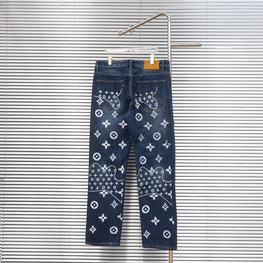 Louis Vuitton denim pants with white monogram pattern, button-fly style