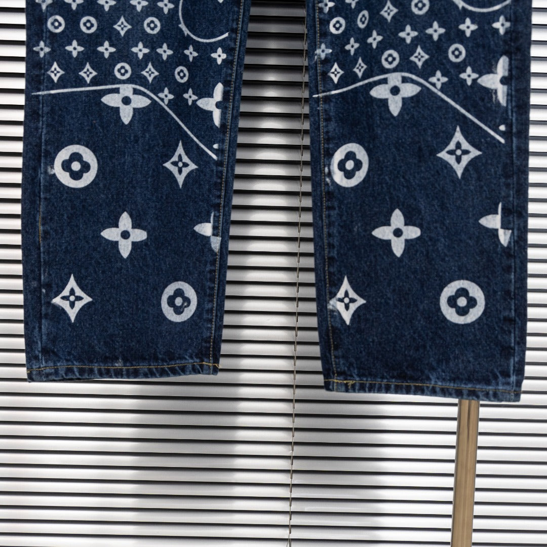 Denim pants hem view with white monogram print on dark blue denim