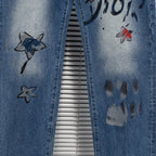 Dior denim pants side with star graphics and dark paint marks on leg