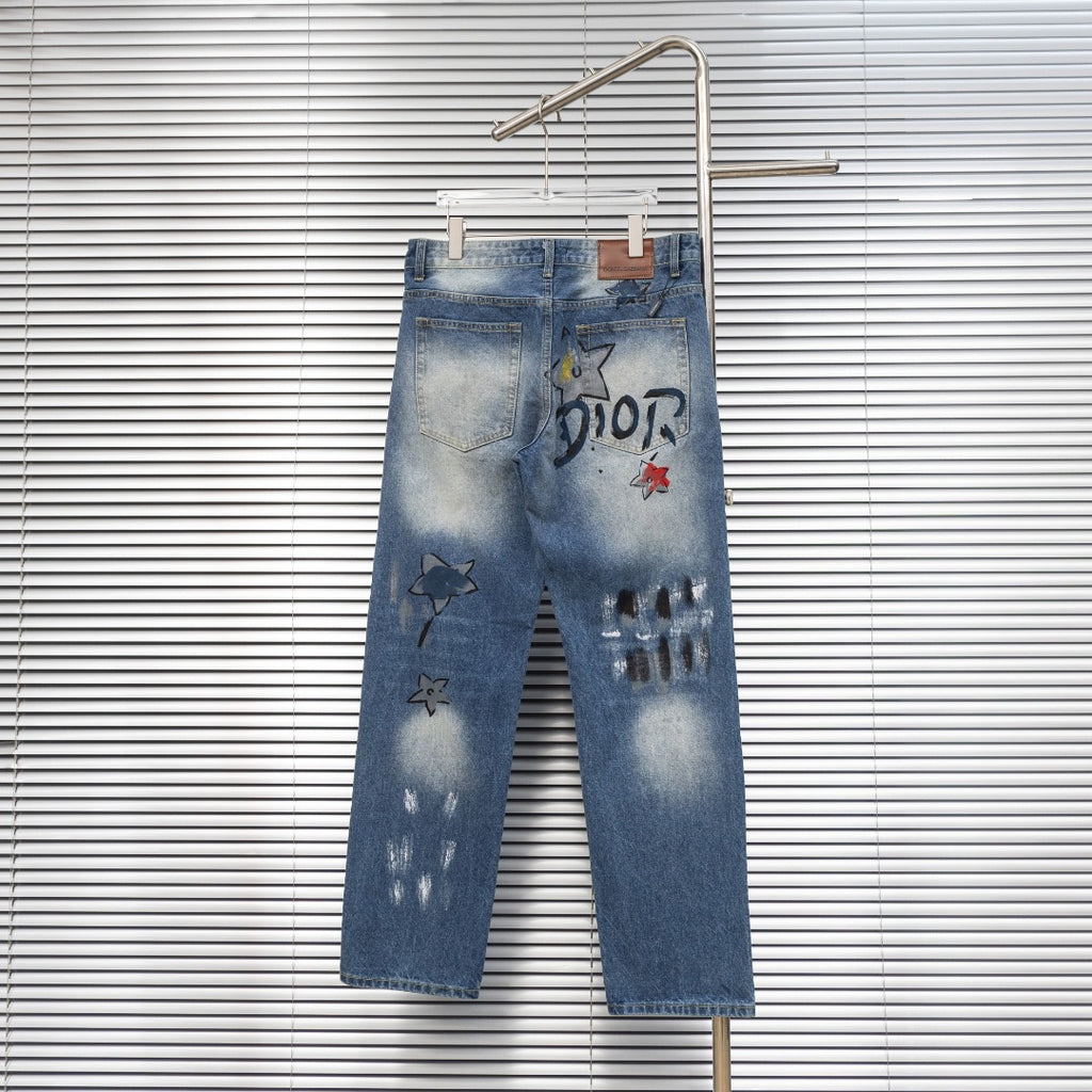 Dior denim pants with DIOR print, star patches, and cuffed hem