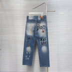 Dior denim pants with DIOR print, star patches, and cuffed hem