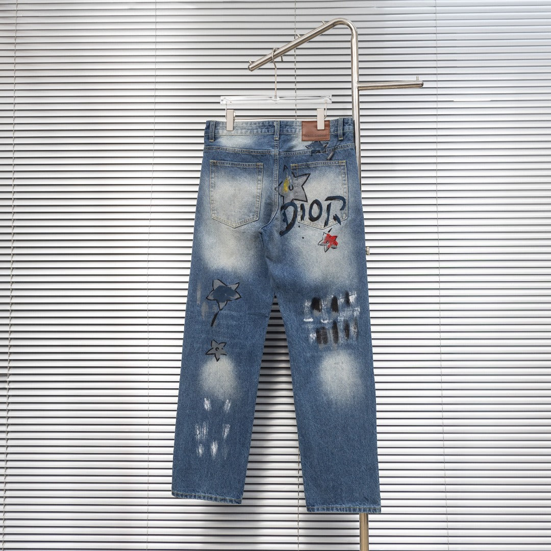 Dior denim pants with DIOR print, star patches, and cuffed hem