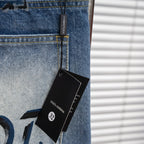 Light-blue jeans with black hang tag on front seam