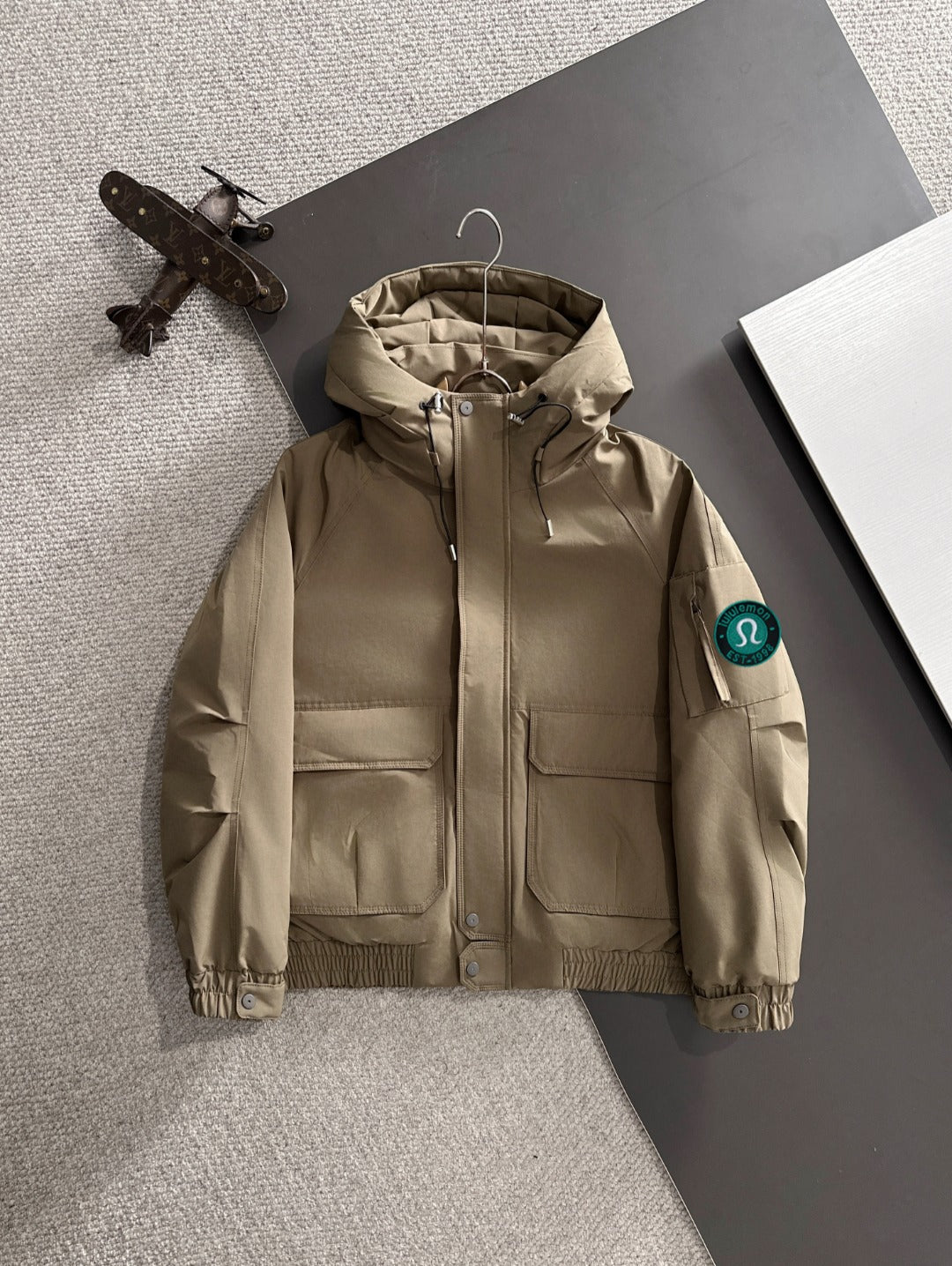 Lightweight hooded jacket in tan, front zip and two chest pockets