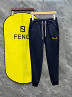 Navy Fendi track pants with white drawstring and side stripe, logo on pocket