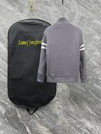 Moncler long puffer jacket back view with gray ribbed knit sleeves