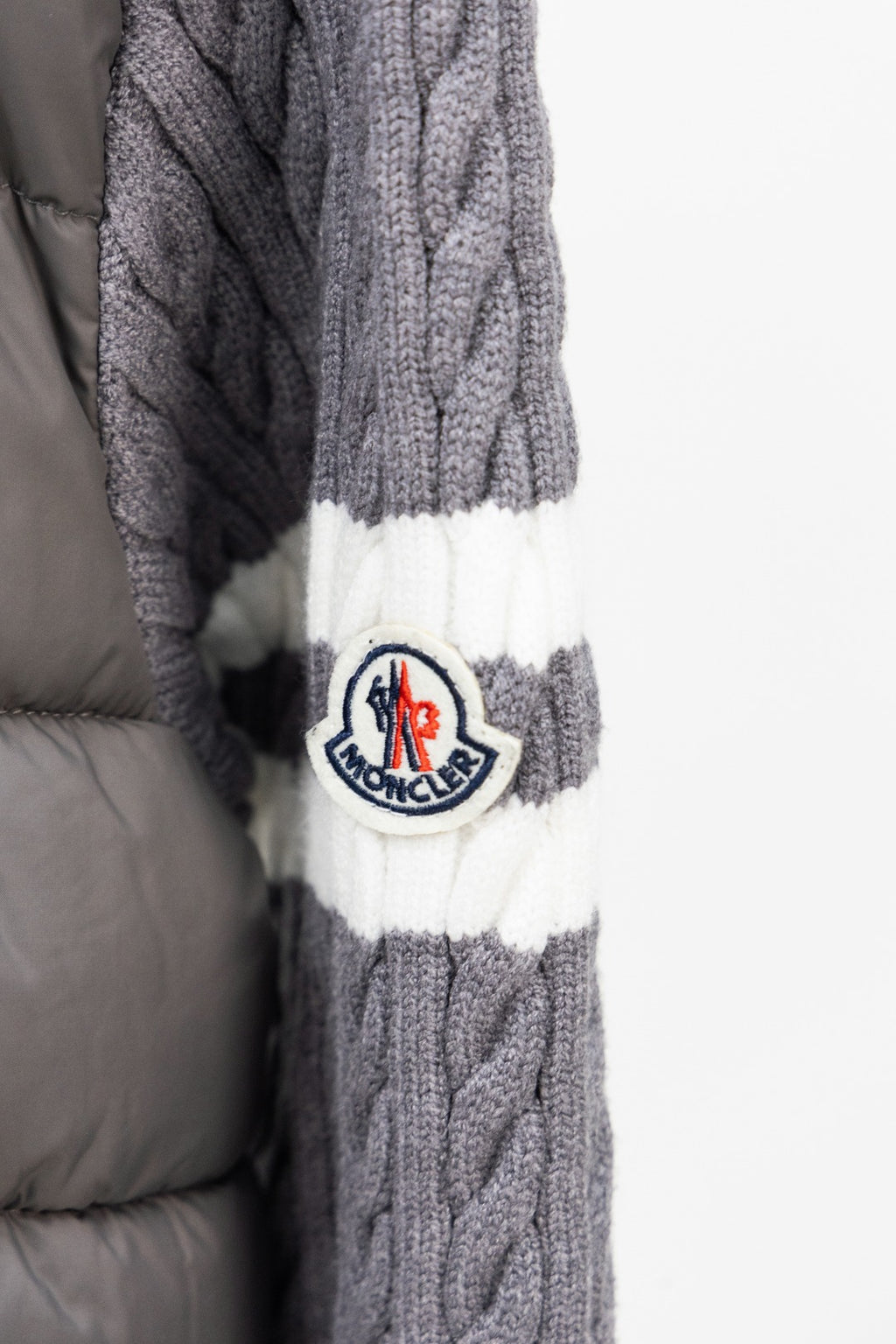 Moncler long puffer jacket sleeve with Moncler patch and white stripe