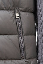 Moncler long puffer jacket front: centered zipper seam on gray quilted fabric
