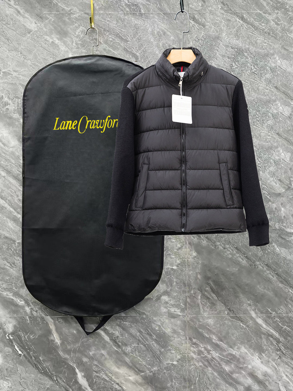 Moncler long black puffer jacket with full zip and stand collar, front view