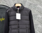 Moncler long black puffer jacket close-up of front zip and quilted panels