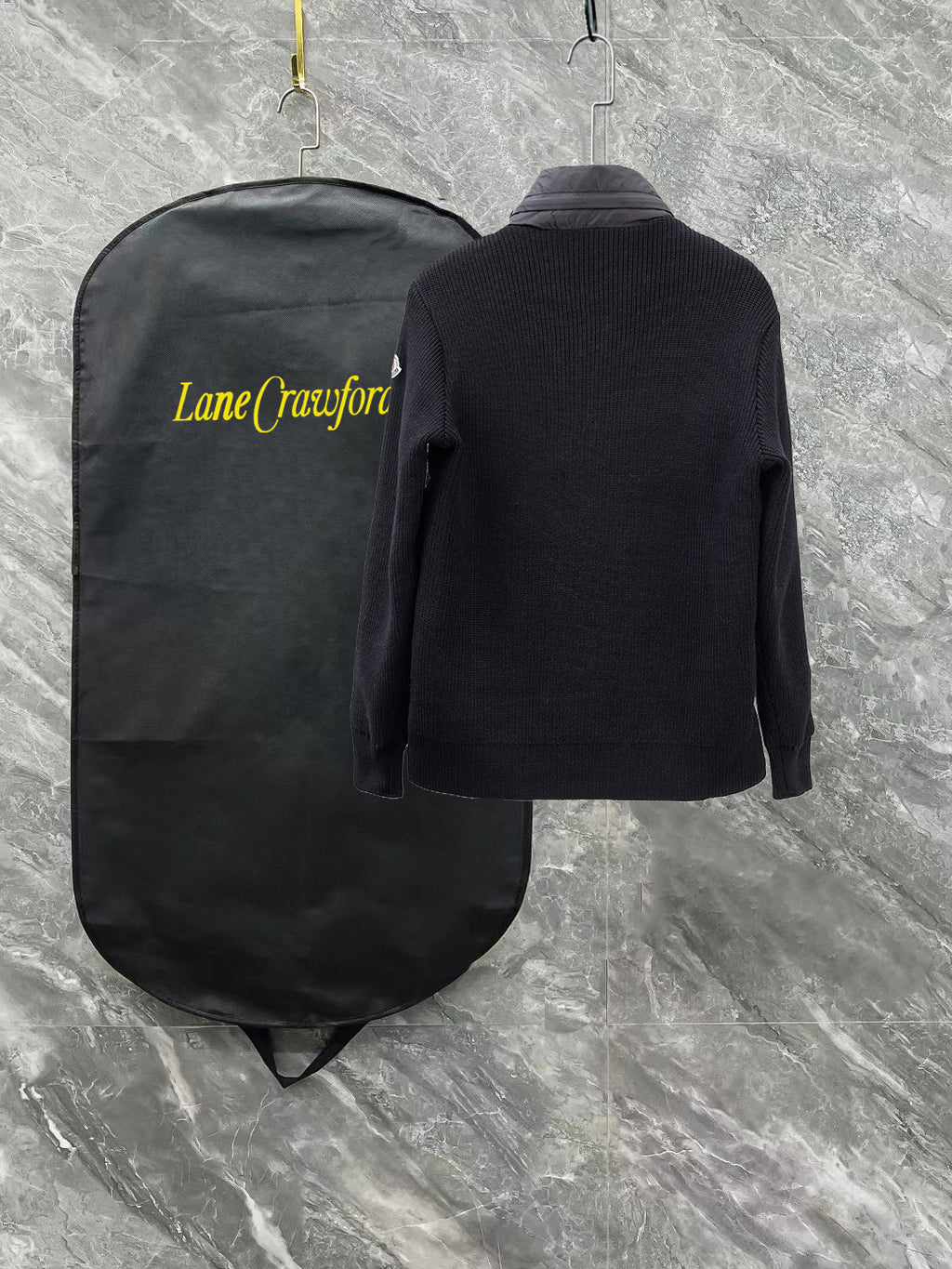 Moncler long black puffer jacket, back view with knit ribbed collar